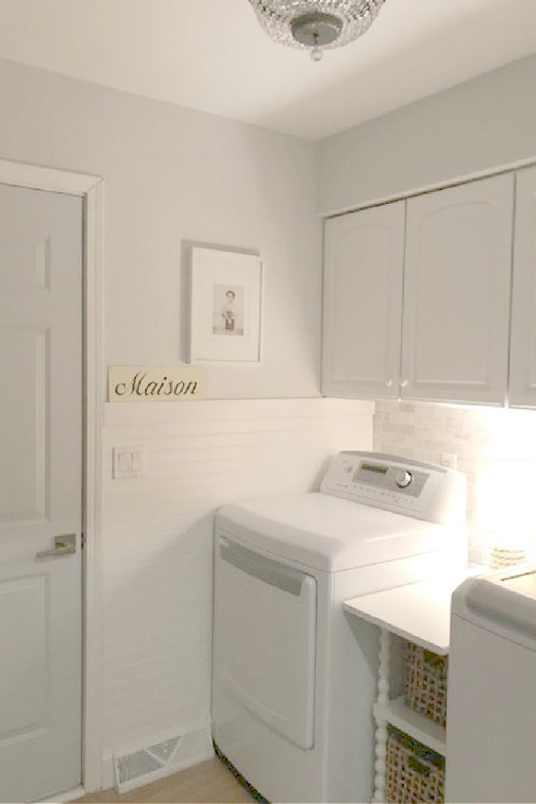 Behr Sterling paint color on walls and door of Hello Lovely's laundry room. #behrsterling #paintcolors #lightgreypaint #bluegrey