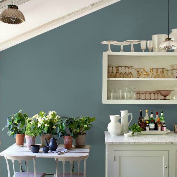 Blue Blood PPG paint color on walls of a rustic kitchen with blue and white.