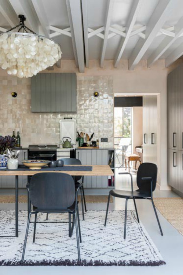 Zellige tiled statement wall in a kitchen with magnificent architecture. Stunning and soulful space designed by Imperfect Interiors in the UK - this East Dulwich Industrial Conversion sings!