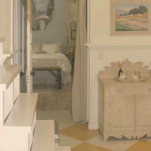 Serene and peaceful, this cottage bedroom with farmhouse style and vintage furniture at Storybook Cottage (near Franklin, TN) was designed by Kim Leggett of City Farmhouse. #farmhousestyle #storybookcottage #cityfarmhouse #bedroom #farmhousebedroom