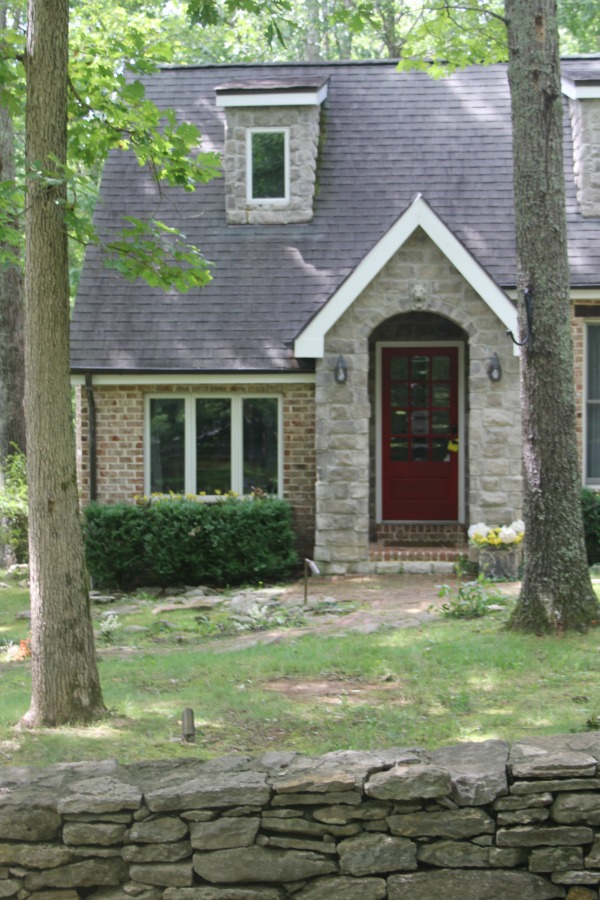 Exterior of cottage. Secluded, woodsy, equestrian acreage at Storybook Cottage near Franklin, TN - Hello Lovely Studio.