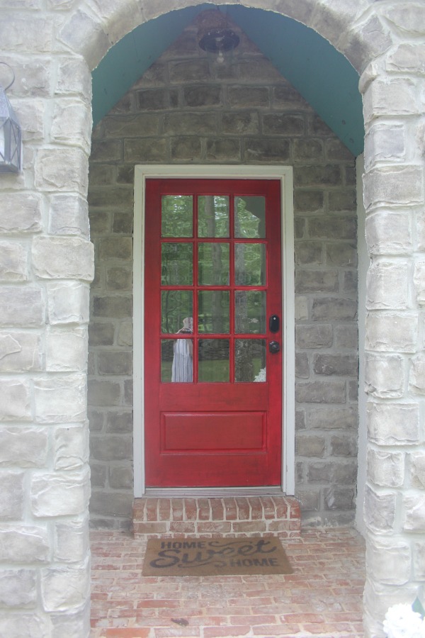 Red front door at Storybook Cottage in Leiper's For, Tennessee - Hello Lovely Studio.