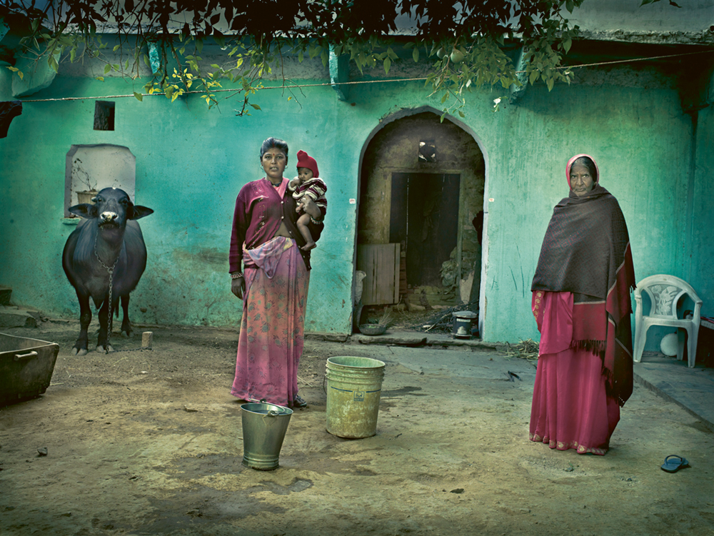 Women in India with turquoise home and cow. Photo © Andreas H. Bitesnich. All rights reserved. Come discover 3 Inspiring Art & Design Books on My Nightstand This Minute I Am Loving!