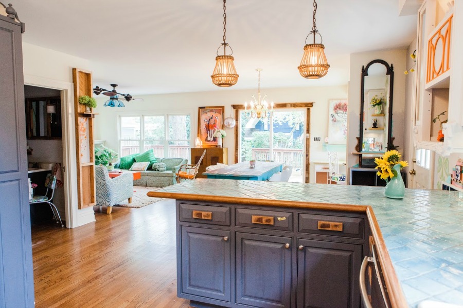 Kitchen with island chic pendants. Be inspired by this photo gallery of vibrant colorful beachy boho interior design from artist Jenny Sweeney's Chicagoland home. Her art has been lifting spirits and opening hearts to wonder - see how it lives large in a charming suburban Tudor!