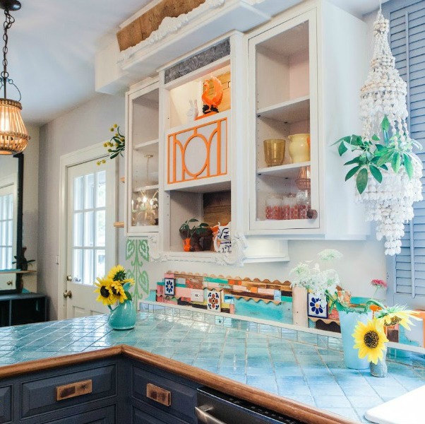 Be inspired by this photo gallery of vibrant colorful beachy boho interior design from artist Jenny Sweeney's Chicagoland home. Her art has been lifting spirits and opening hearts to wonder - see how it lives large in a charming suburban Tudor!