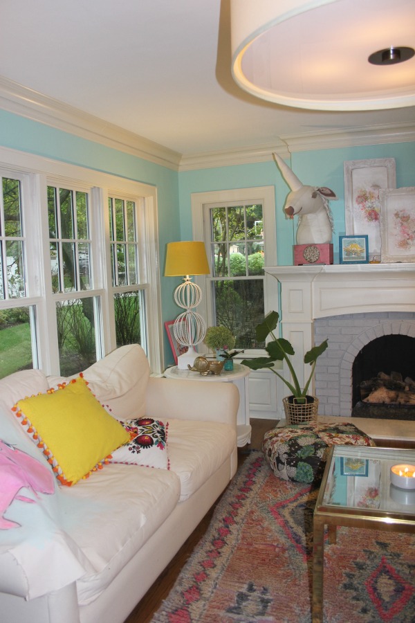 Boho style and vintage charm in a colorful, playful, laid back living room by Jenny Sweeney. #bohodecor #colorfuldecor #interiordesign #eclectic