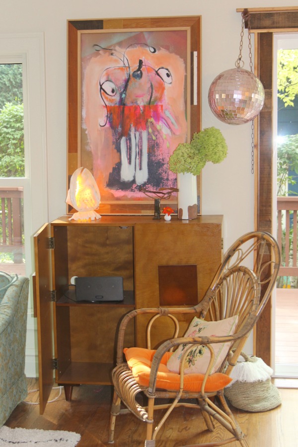 Boho style and vintage charm in a colorful, playful, laid back living room by Jenny Sweeney. #bohodecor #colorfuldecor #interiordesign #eclectic