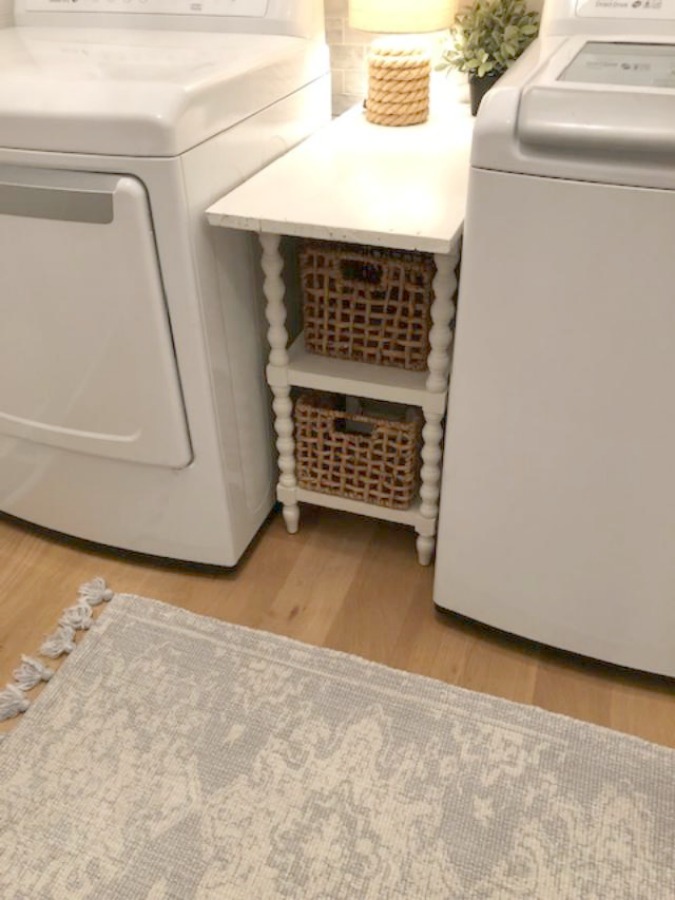 Come see how I made our awful little pass through laundry room next to the garage function better and look peaceful with simple inexpensive DIY - Hello Lovely Studio. #beforeafter #laundryroom #diy #makeover #serenedecor