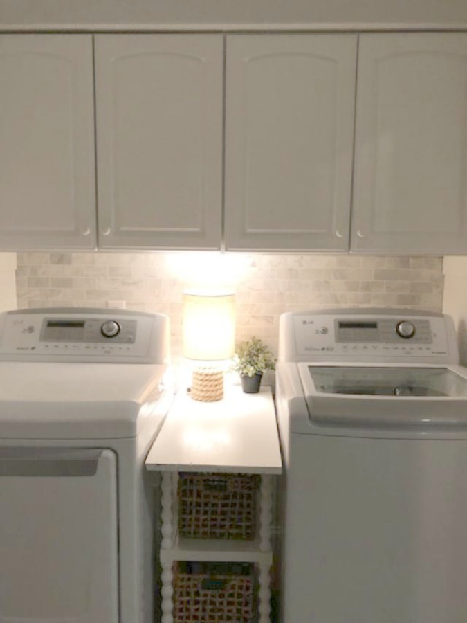 Come see how I made our awful little pass through laundry room next to the garage function better and look peaceful with simple inexpensive DIY - Hello Lovely Studio. #beforeafter #laundryroom #diy #makeover #serenedecor