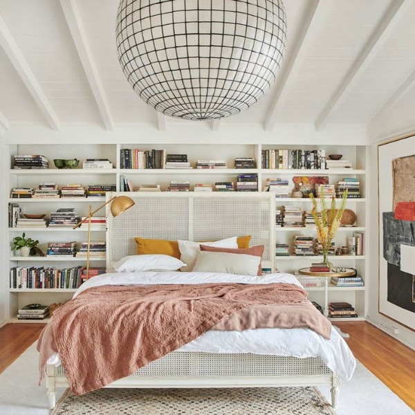 Leanne Ford's bedroom with white built-in shelves, Matteo linens, and overscaled light. Photo by Tessa Neustadt.