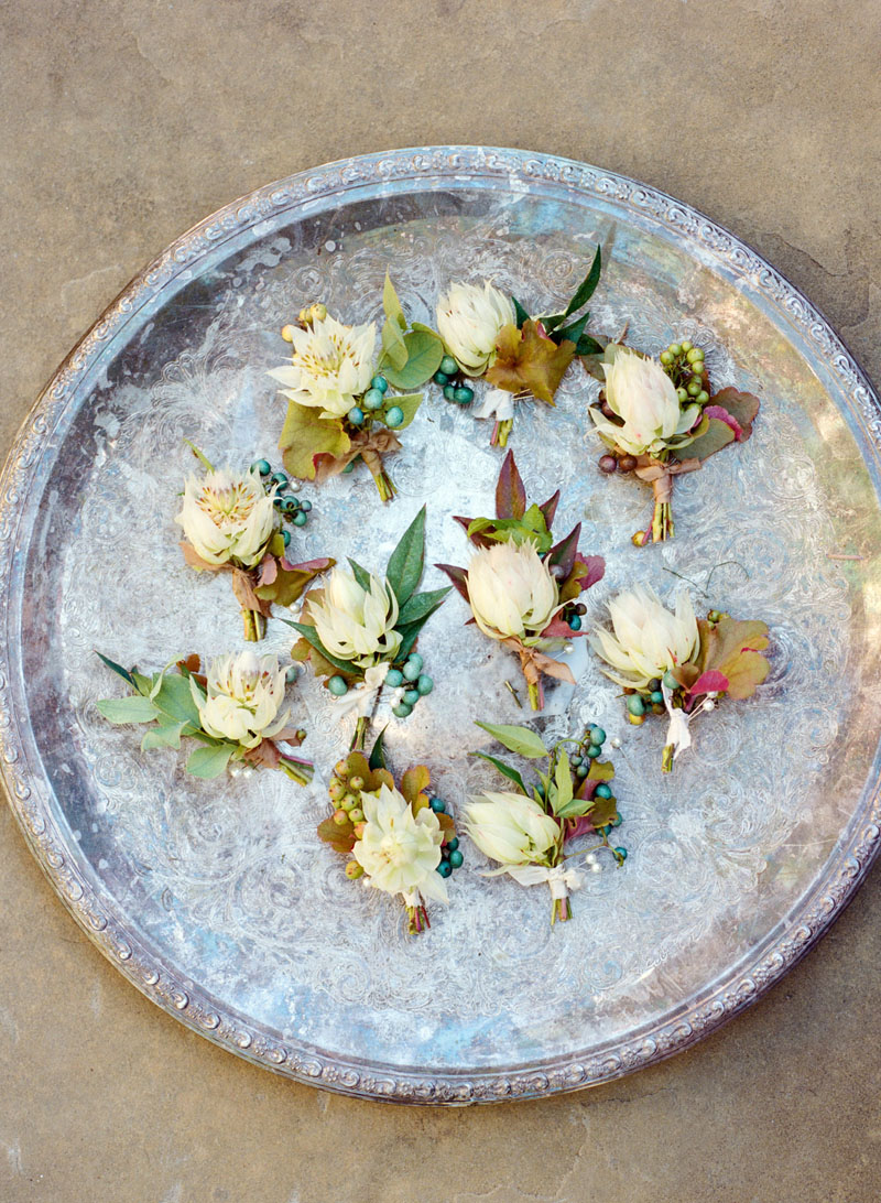 Gorgeous silver tray with fall wedding boutinieres by Sarah Winward - photo by Kate Osborne. #weddingflorals #boutinieres #freshflorals