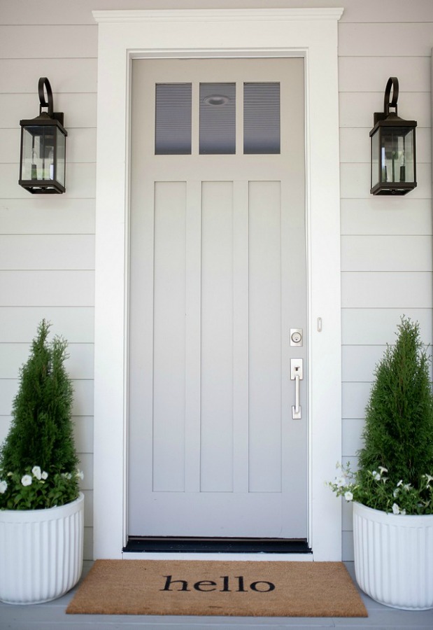 Repose Gray by Sherwin Williams paint color on the siding and Dorian Gray painted front door by Bell Sheep Studio. #paintcolors #bestgrey #doriangray #reposegray #interiordesign