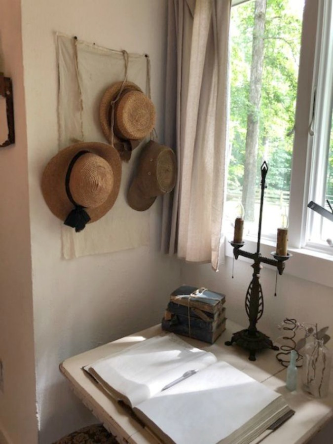 Serene and peaceful, this cottage bedroom with farmhouse style and vintage furniture at Storybook Cottage (Leiper's Fork, TN) was designed by Kim Leggett of City Farmhouse. #farmhousestyle #storybookcottage #cityfarmhouse #bedroom #farmhousebedroom