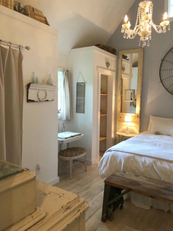 Serene and peaceful, this cottage bedroom with farmhouse style and vintage furniture at Storybook Cottage (Leiper's Fork, TN) was designed by Kim Leggett of City Farmhouse. #farmhousestyle #storybookcottage #cityfarmhouse #bedroom #farmhousebedroom