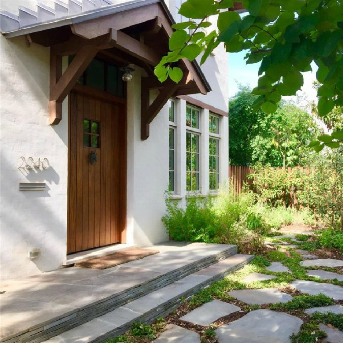 Side entrance of a magnificent Modern Belgian Houston home by architect Kelly Cusimano and crafted by Marcellus Barone of Southampton Homes. #belgianartchitecture #houseexterior