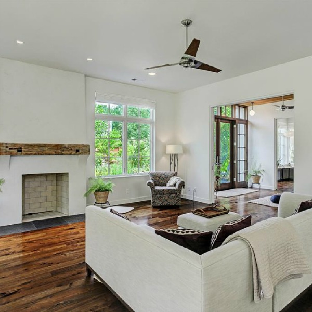 Belgian living room with minimal decor, plaster walls, and simplicity in a zen Houston home by architect Kelly Cusimano and crafted by Marcellus Barone of Southampton Homes. #belgianstyle #livingroom #modernbelgian #Europeancountry #minimaldesign