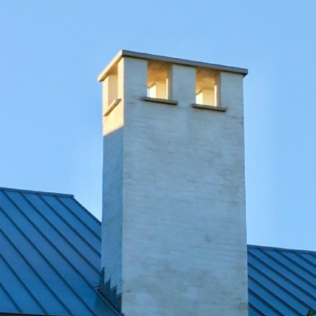 Detail of a metal roof and chimney at a magnificent modern Belgian style home in Houston by Southampton Homes. #belgianstyle #roof #housedesign