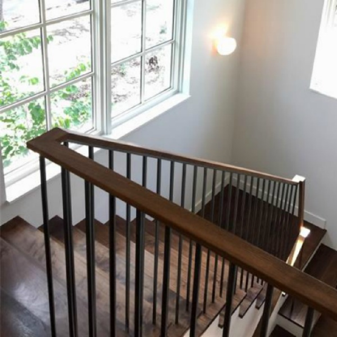 Modern Belgian style interior design shines in the architecture, interior design, and construction of a wood staircase - Southampton Homes.