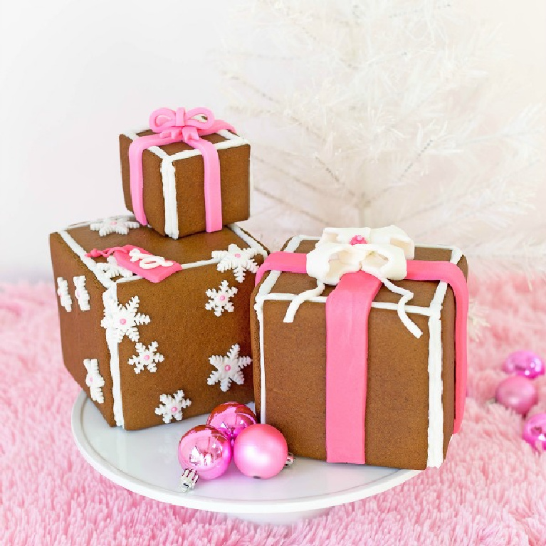 Gingerbread gift boxes with fondant ribbon and pink accents for a cheerful whimsical Christmas - Awwsam. #christmasbaking #pinkchristmas #gingerbread