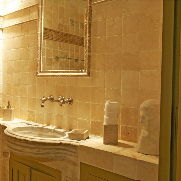 Tumbled stone in an 18th century French bastide bathroom. A breathtaking French bastide in Bonnieux in the South of France - a luxurious vacation home by Haven In. #frenchcountry #southoffrance #luxuryhome #frenchvilla