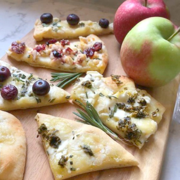 Hello Lovely's 10 minute cheesy easy festive appetizer comes together quickly with store-bought flatbread! Perfect for holiday entertaining and Thanksgiving. #appetizer #easyrecipes #flatbread #briecheese