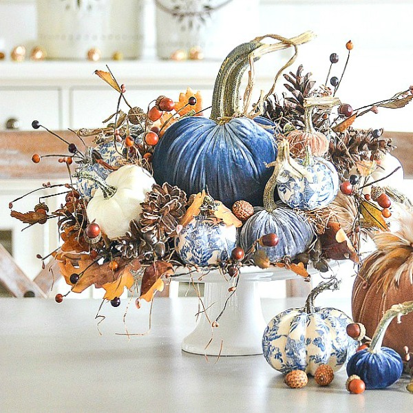 When you are after an elegant centerpiece for the table to celebrate fall pumpkins, here's the ticket from Stone Gable. Velvet, blue, chinoiserie, and lovely non-traditional color! #centerpiece #fall #pumpkins #tablescape #velvetpumpkins #chinoiserie