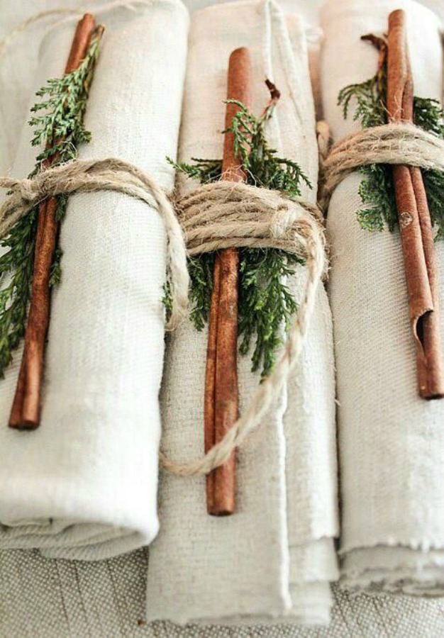 Holiday decor inspiration for the table with these rustic natural organic linen napkins wrapped simply in twine and greenery. #simplechristmas #holidaydecor #napkins #tablescape