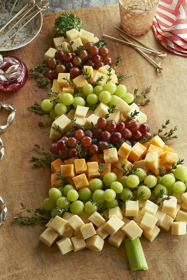 Whimsical presentation of cheese and fruit for Christmas party entertaining! Ciao Newport Beach. #christmastree #appetizer #cheeseboard #entertaining #appetizers