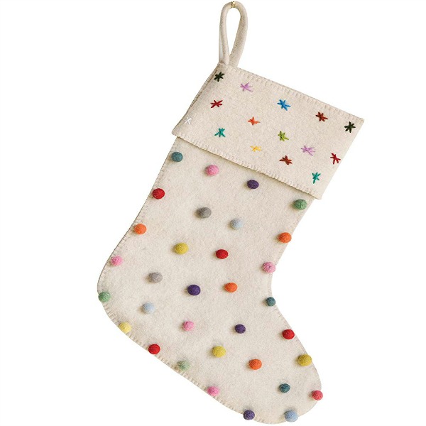 Pom Pom Christmas stocking is a colorful and whimsical holiday nod to make your mantelscape cheerier. #holidaydecor #christmas #stocking #pompoms