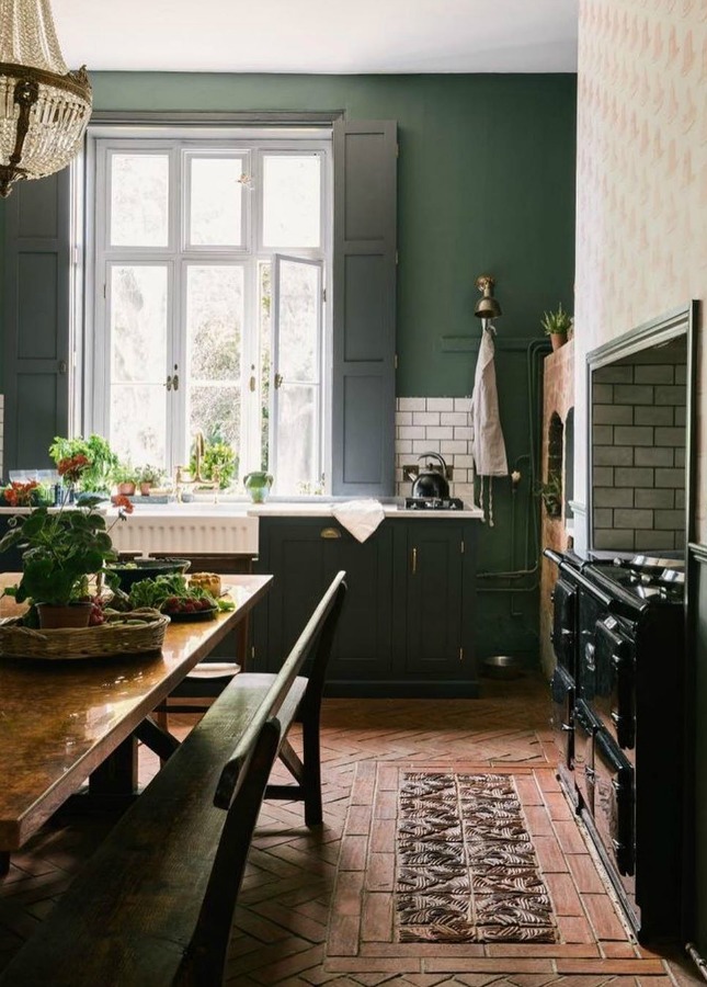 Deep green walls in an English country kitchen by deVOL kitchens. #englishcountry #kitchendesign #greenkitchen #devol #aga