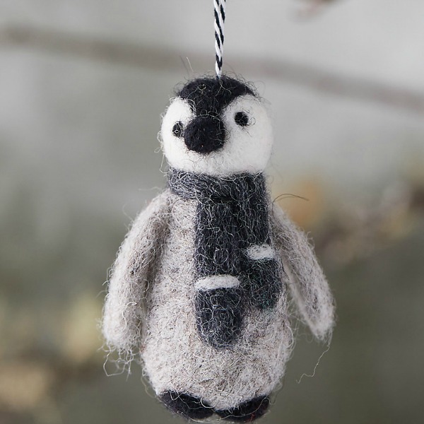 Felted wool penguin looks darling on the tree or from a door knob during the holidays and all winter through. #penguin #feltedwool #ornaments #christmasdecor