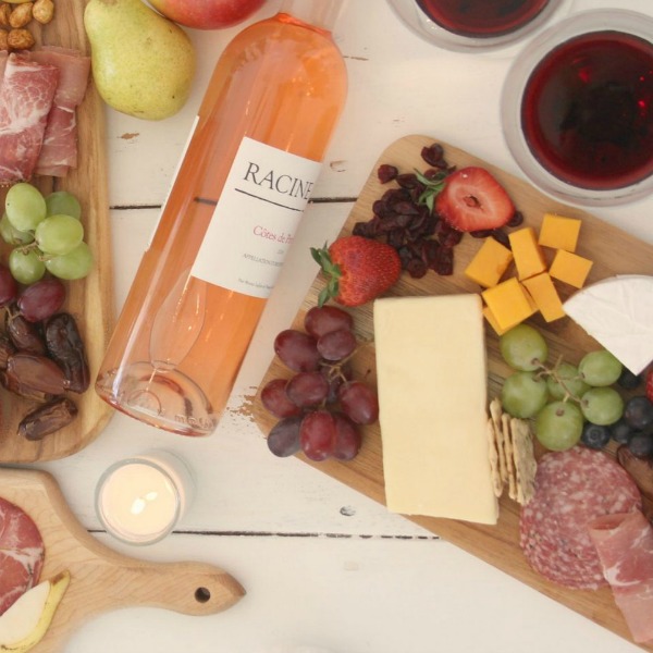 Vibrant colors for these easy to assemble graze boards (cheese boards!) with fruit, nuts, and wine - Hello Lovely Studio. #grazeboard #howto #cheeseboard #entertaining #cheese