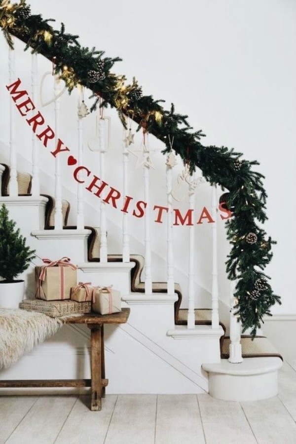 Simple Christmas banner and greenery on staircase - a lovely fresh country welcome! #christmasdecor #staircase #greenery #holidaydecorating