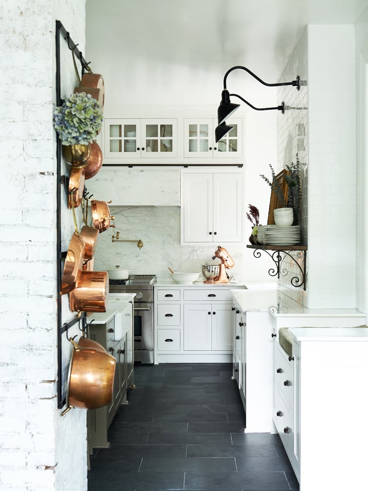 Leanne Ford designed kitchen with black and white and copper! #leanneford #kitchendesign #farmhousekitchen #blackandwhite