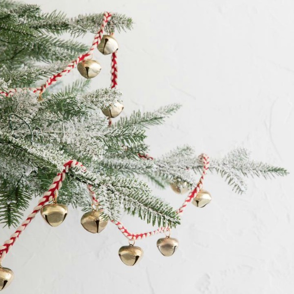 Sleigh bell garland for the Christmas tree adds nostalgia and sweetness to the holiday decorating. #sleighbells #holidaydecor #christmastree #garland