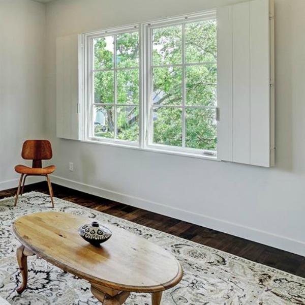 Interior shutters, plaster walls, and minimal decor in a zen home by architect Kelly Cusimano and crafted by Marcellus Barone of Southampton Homes. #belgianstyle #interiordesign #oldworld #minimal