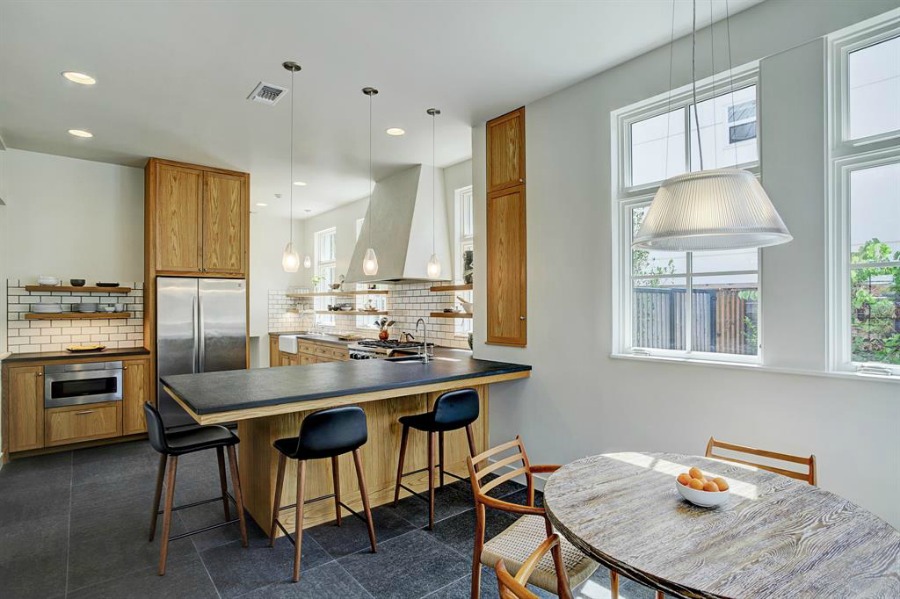 Belgian kitchen design with natural materials, plaster, and stone in a zen Houston home by architect Kelly Cusimano and crafted by Marcellus Barone of Southampton Homes. #belgianartchitecture #belgiankitchen #oldworld #minimal