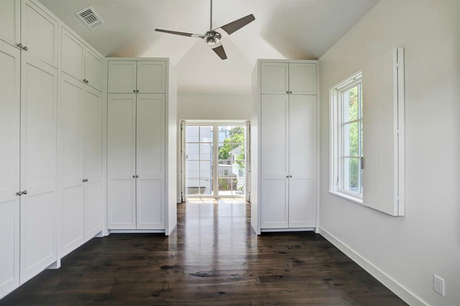 Modern Belgian interior design within a Houston bedroom with built-ins, plaster walls, and exceptional architecture and design by Southampton Homes. #belgianstyle #interiordesign #minimal