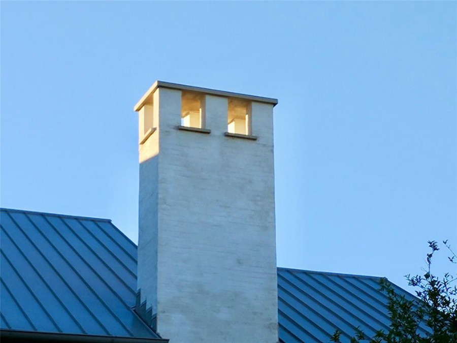 Detail of a metal roof and chimney at a magnificent modern Belgian style home in Houston by Southampton Homes. #belgianstyle #roof #housedesign