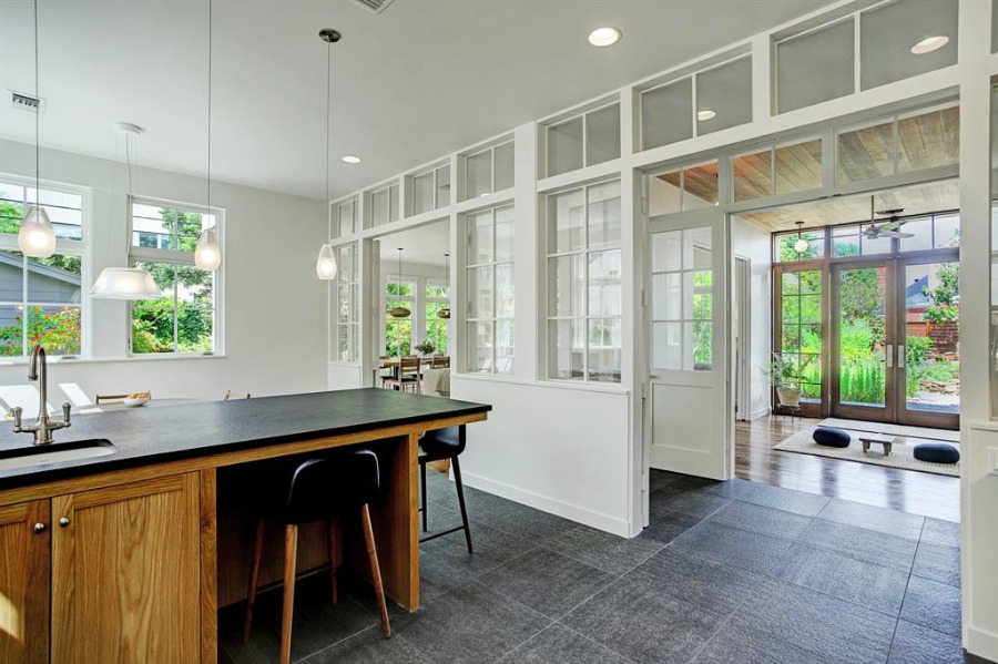 Abundant windows, light, and airy zen vibes flow through a magnificent modern Belgian home by Southampton in Houston. #belgianstyle #housedesign #interiordesign #belgianarchitecture