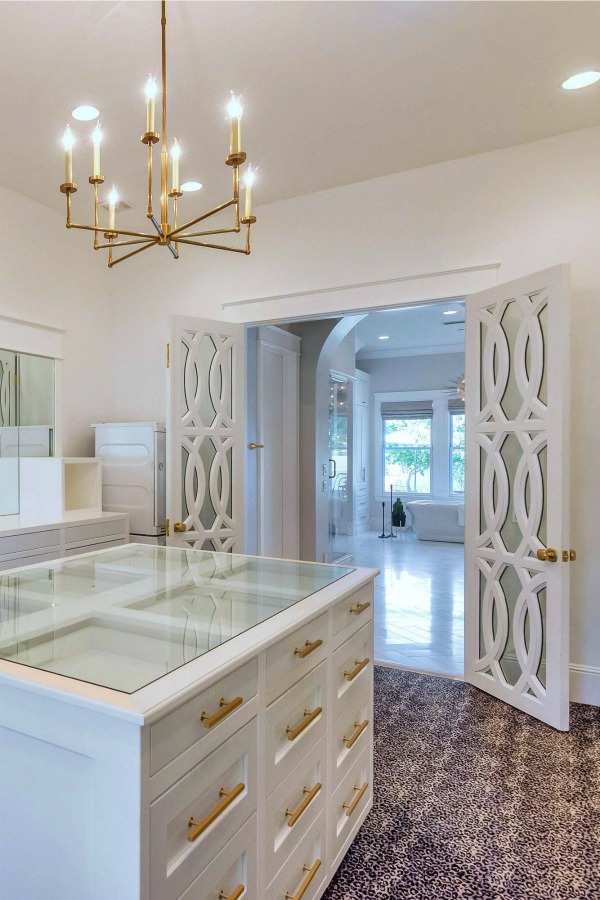 Luxurious and spacious dressing room closet in a modern French home. #closetdesign #dressingroom #modernfrench #luxuriousdesign