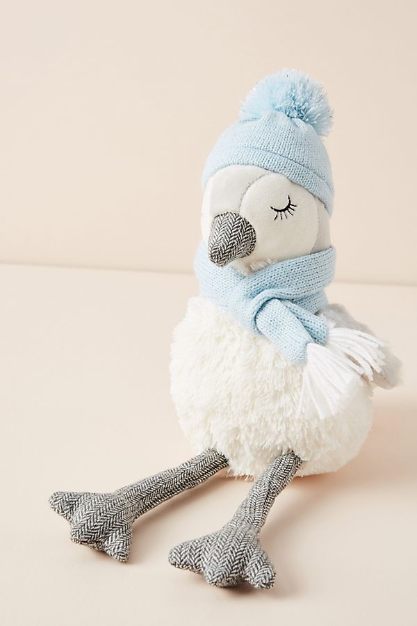 Stuffed penguin with winter pom pom hat adds sweetness to your holiday decor. #penguin #christmasdecor