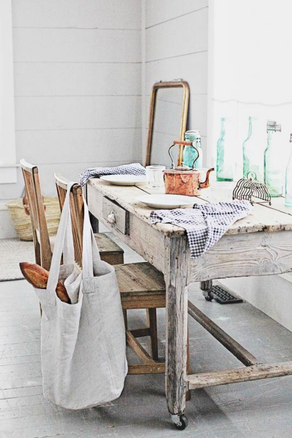 White French farmhouse style interior by Dreamy Whites with rustic farm table and chairs. Come see more ideas from these white country interiors.