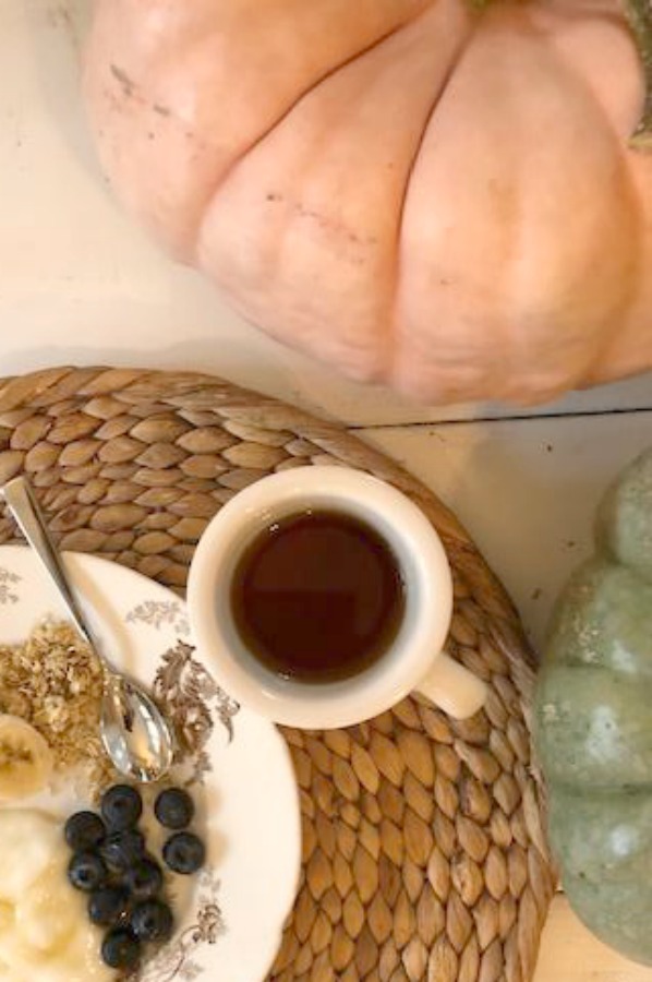 Soft serene fall color palette decor from Cinderella pumpkins, pale pink ballet slippers, and natural fallen leaves upon my kitchen farm table - Hello Lovely Studio. #pastels #softcolors #autumn #decorating #fallcolor #shabbychic