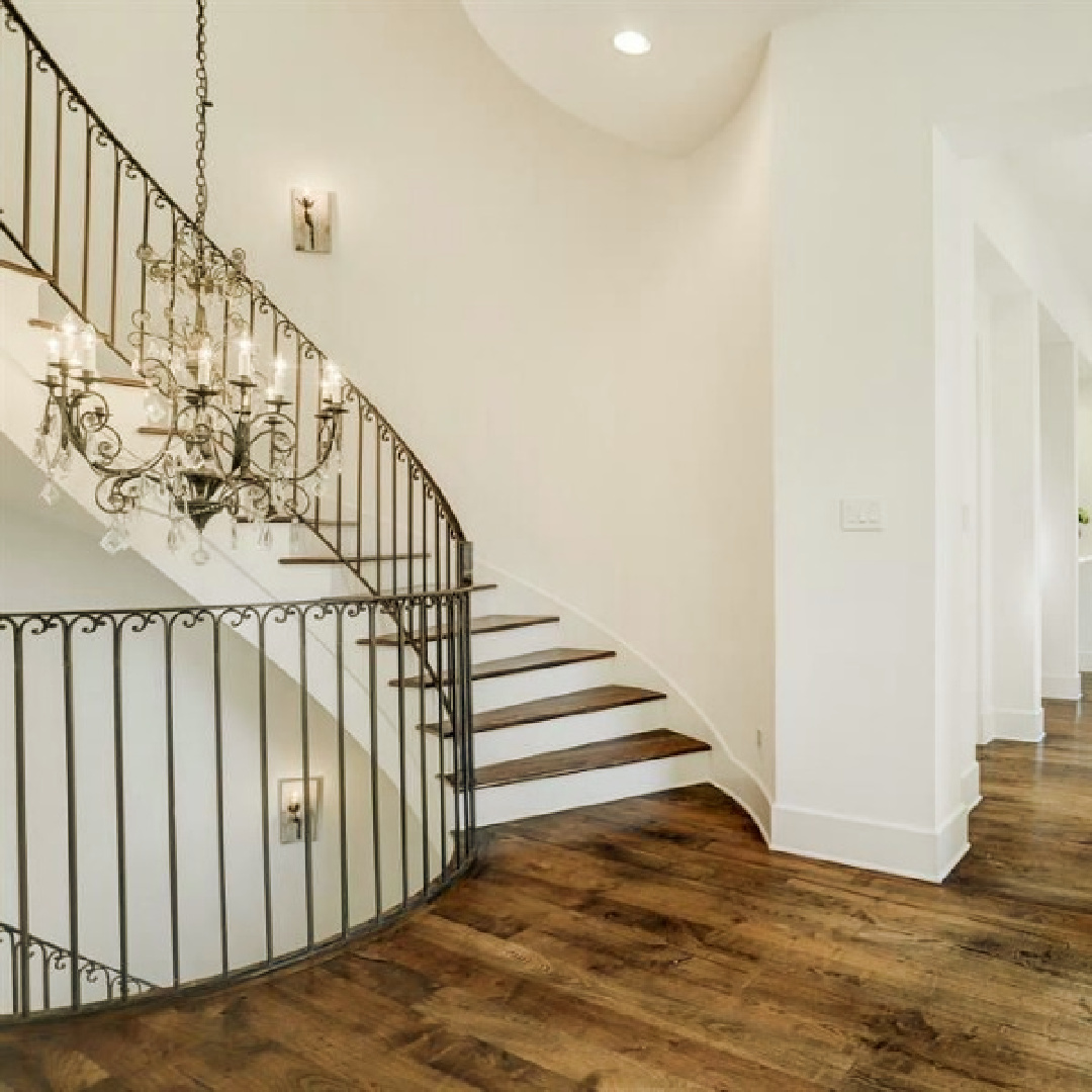 Gorgeous modern European country design style in this Houston home by Southampton. #europeancountry #interiordesign #whitedecor #modernfrench #staircase