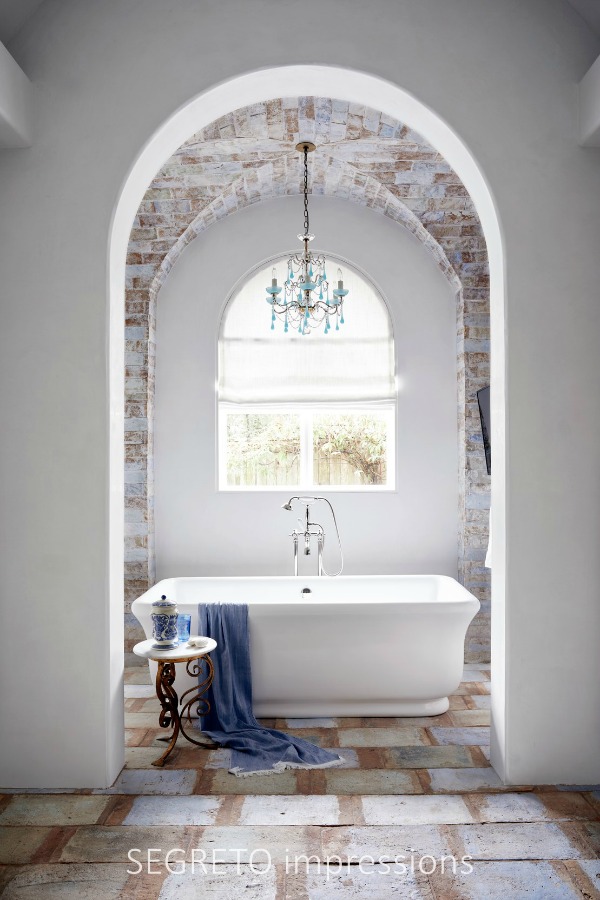 From SEGRETO impressions (2019) by Leslie Sinclair. The unique flooring in this Spanish-style home's master bath is actually antique Parefeuille ceiling tile. #oldworld #interiordesign #spanishstyle #bathroom #plasterwalls