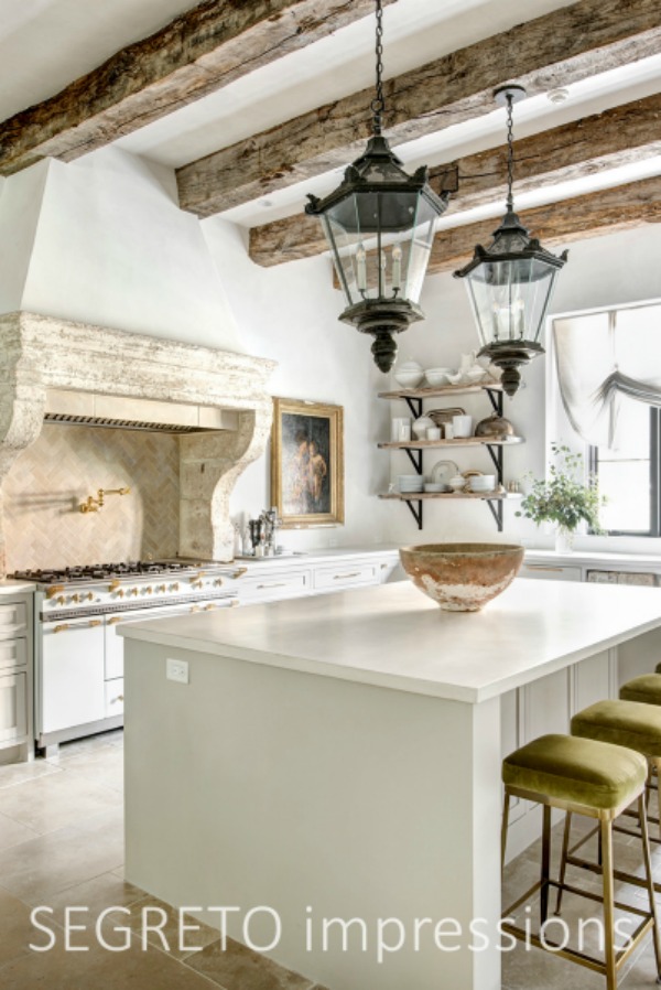 French country Old World kitchen with reclaimed materials (Chateau Domingue) and masterful finishes from SEGRETO. From the 2019 book by Leslie Sinclair.  #kitchendesign #frenchkitchen #antiques #oldworld #plasterwalls