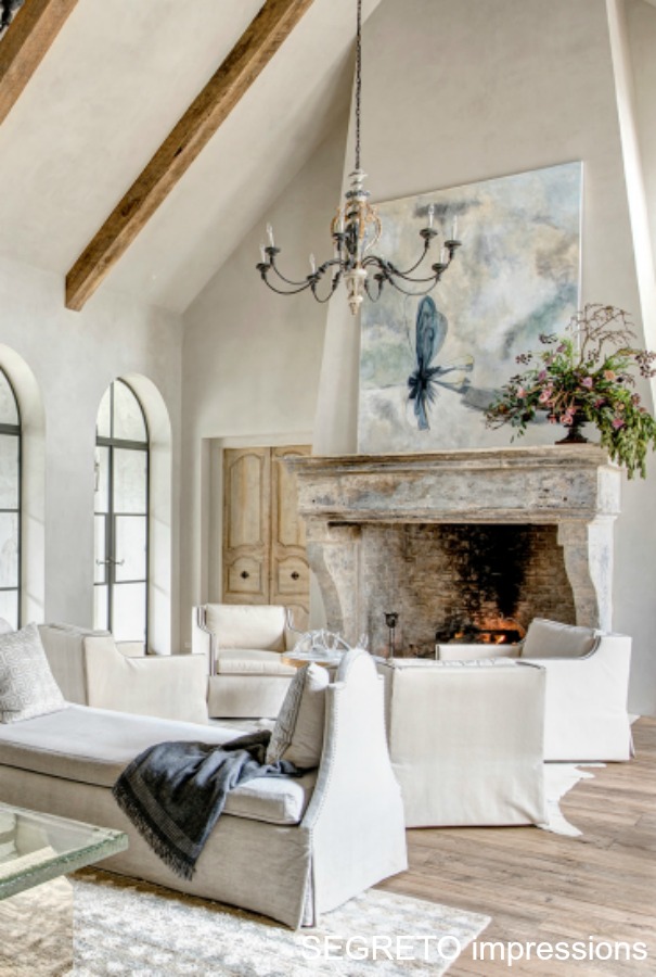 From SEGRETO impressions (2019) by Leslie Sinclair. This great room incorporates beams from the homeowner's South Texas ranch as well as 18th-century doors from Avignon. #interiordesign #frenchcountry #plasterwalls #greatroom