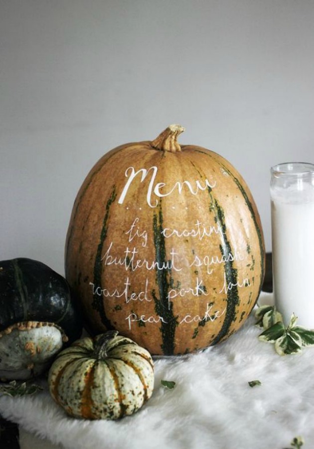 Simple and lovely fall dinner table idea with menu hand lettered directly on pumpkin! #falltable #thanksgiving #tablescape #tablesetting #tabledecor