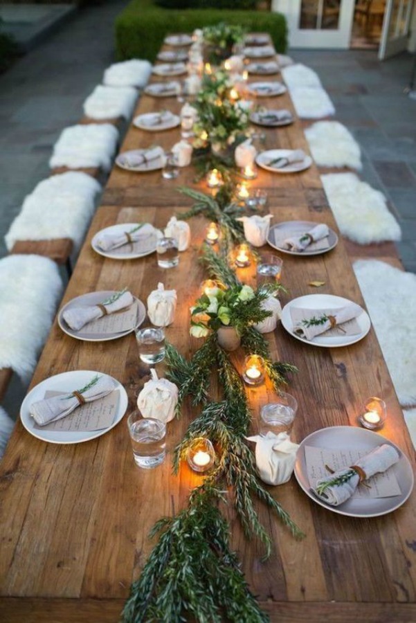 Thanksgiving table setting idea with sheepskin, rosemary and minimal organic style - via Williams Sonoma. #thanksgiving #tablescape #tablesetting #sheepskin #minimal #organic